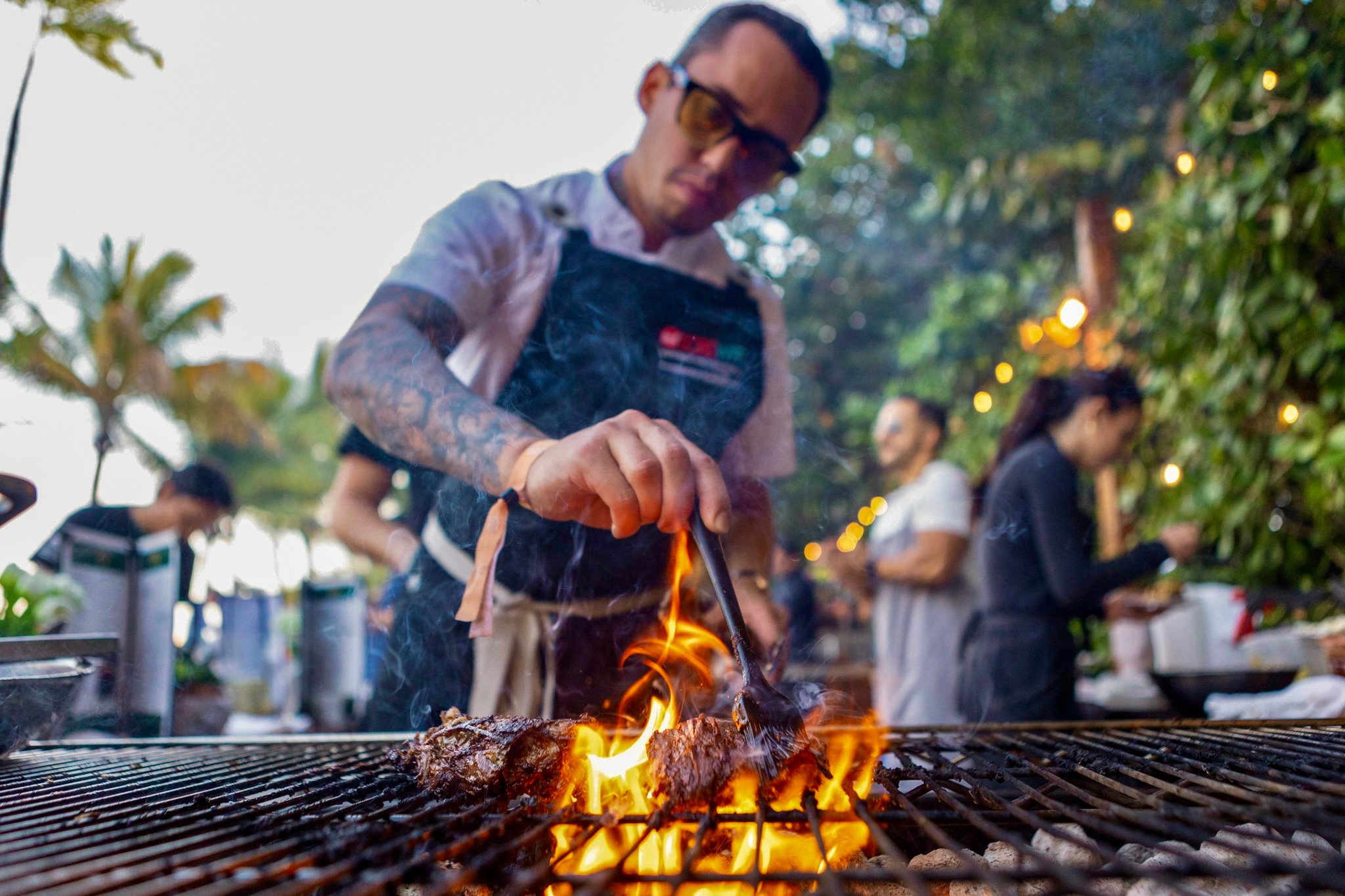 Chef grilling over open flames at SOBEWFF