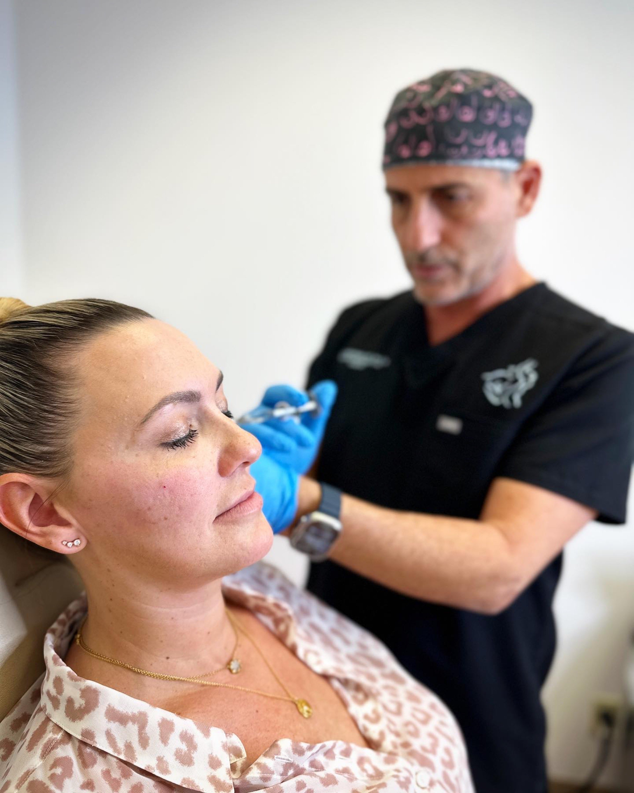 Dr. Roudner performing an injectable treatment