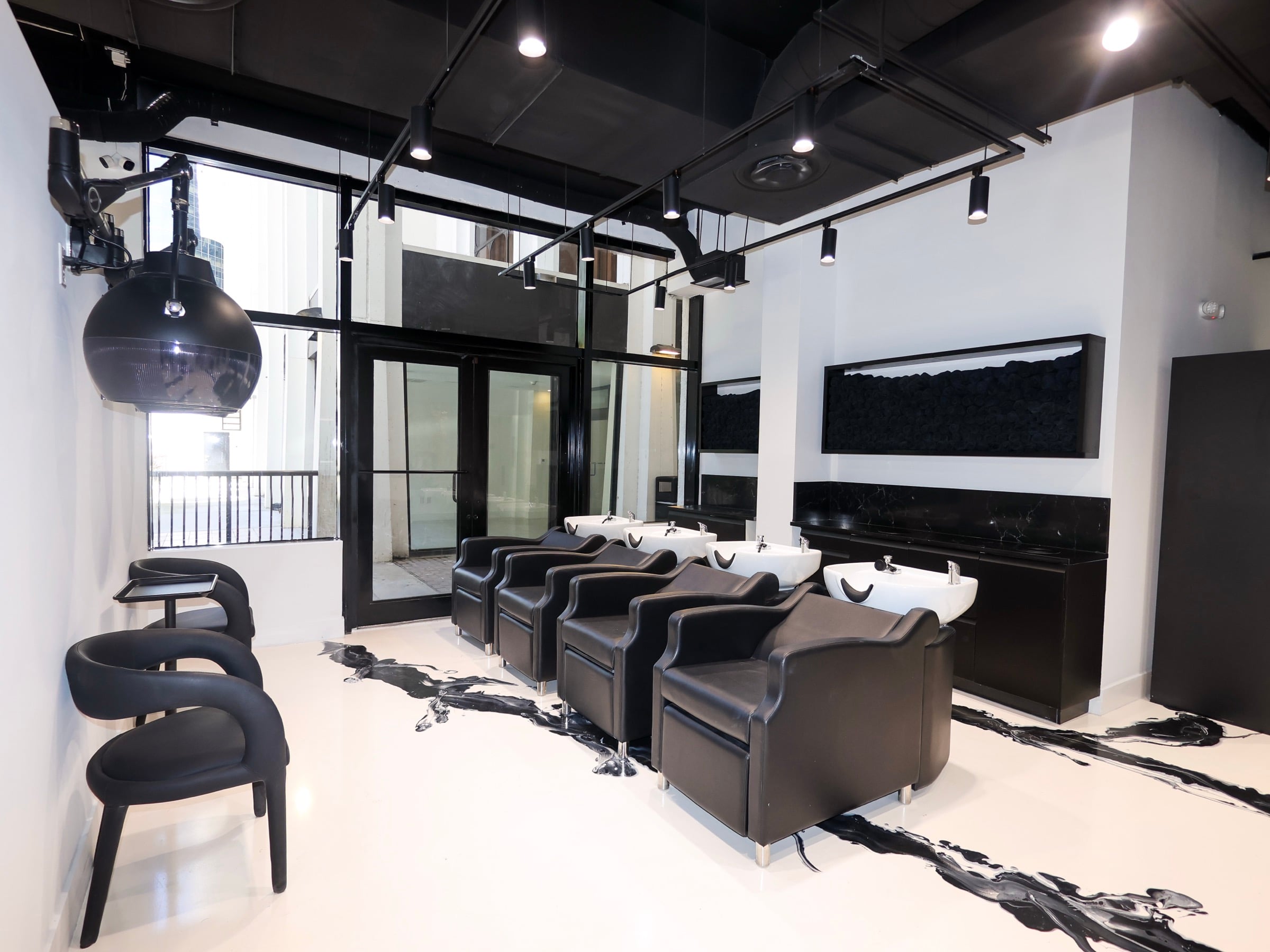 Back hall wash bowls at the Neish Hair Brickell salon
