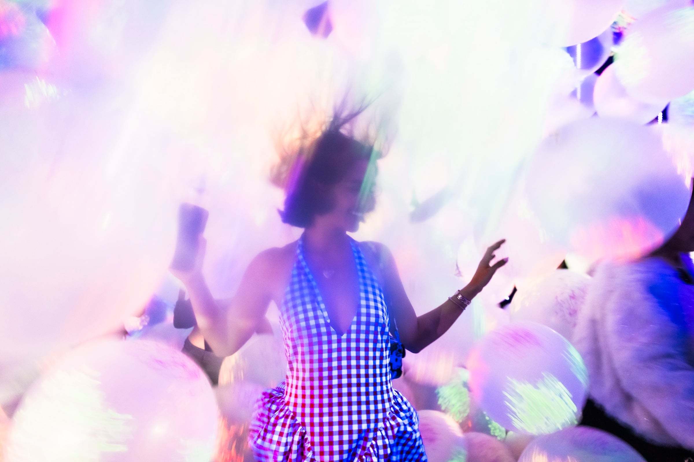 Visitor among colorful inflatable installations at Balloon Museum Miami