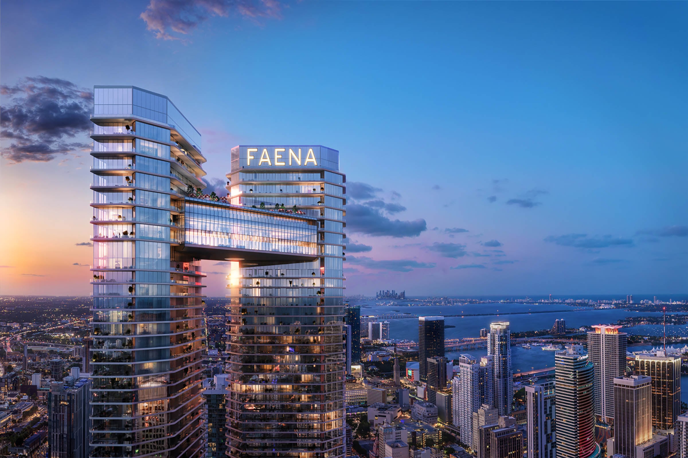 Twin-tower rendering of Faena Residences on the Miami River at dusk