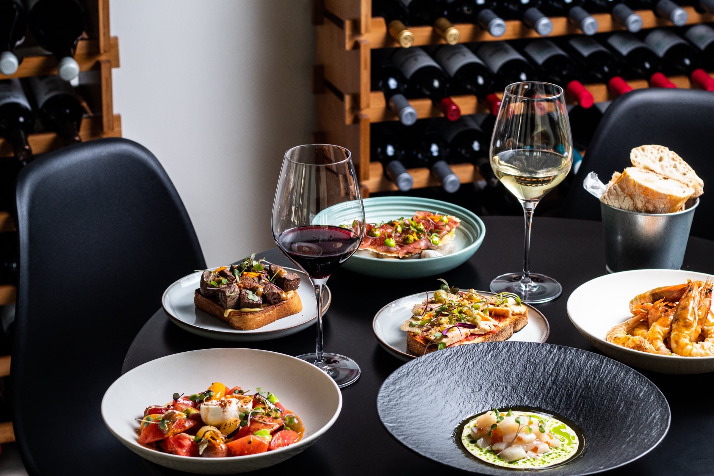 Seasonal tasting menu dishes and wine at Edan Bistro in North Miami