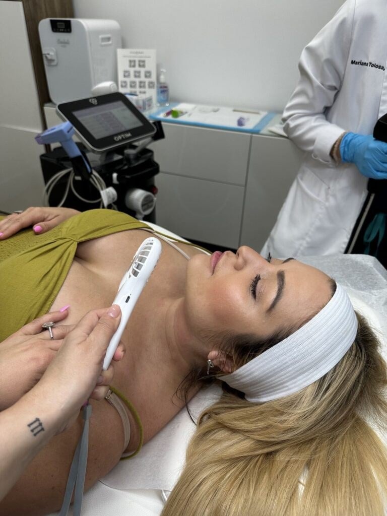 A practitioner performs a Morpheus8 radiofrequency microneedling treatment on a patient's neck at Miami Skin Spa