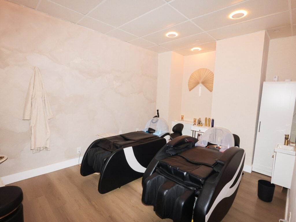 The head spa room at Skin House of Beauty, with two reclining wash chairs and basins