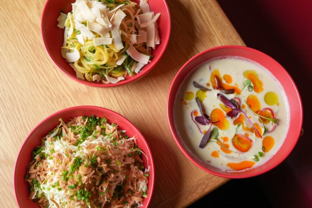 Three shareable dishes at CHŌ Funky Asian Bistro in Miami Beach