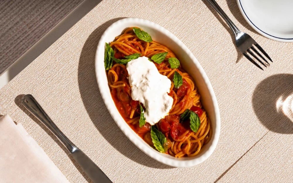 Spaghetti with tomato sauce, basil, and burrata at Le Specialità Café & Market in Coconut Grove