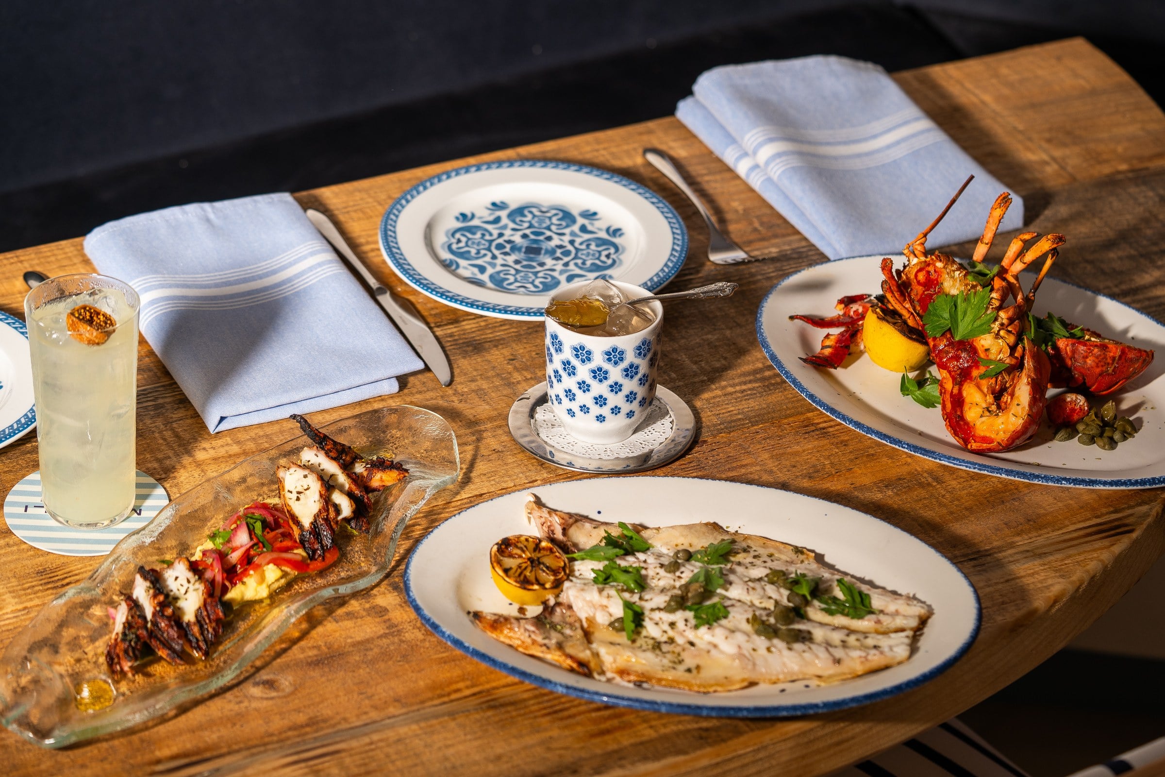 Grilled branzino, lobster, and octopus at Manoli in Coconut Grove