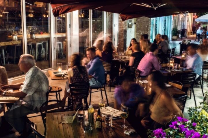 Diners at candlelit tables on Barceloneta’s terrace in Sunset Harbour at night