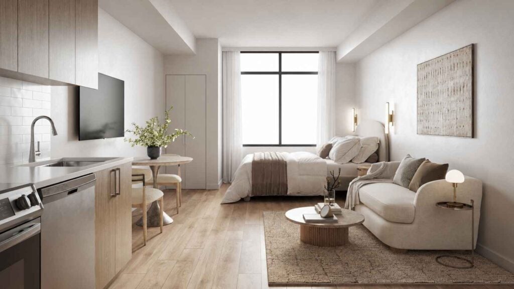 Studio apartment with kitchen, bed, and sofa at Excel Miami