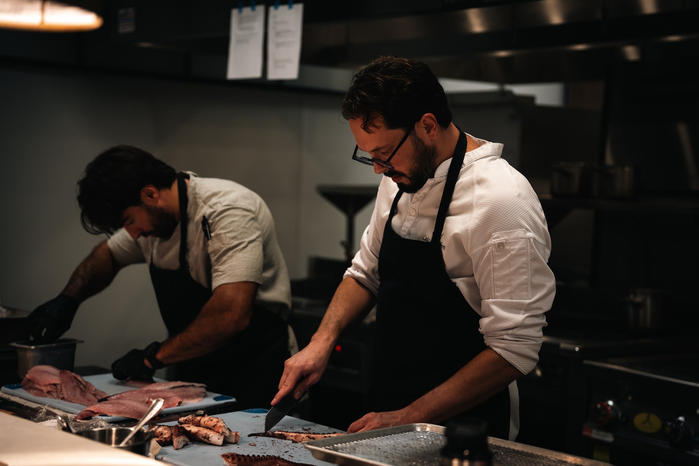 Chefs preparing dishes in the open kitchen at LITO in Wynwood