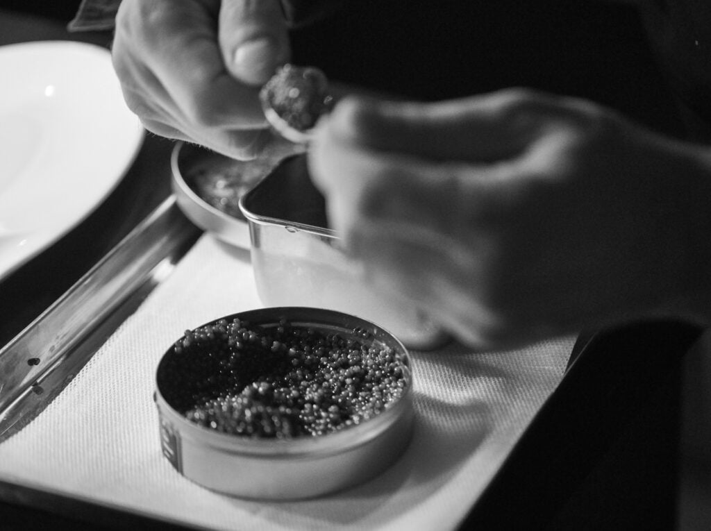 Caviar being served from a tin at L’Atelier de Joël Robuchon Miami