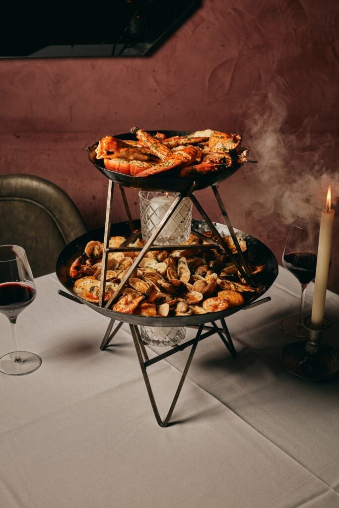 The fire-roasted seafood tower at Maple & Ash Miami